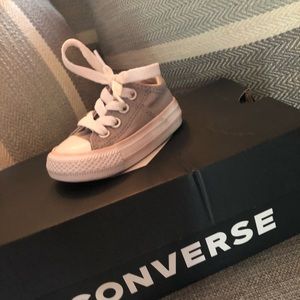 Grey converse with a little pink/cream line